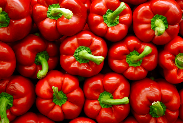 Vibrant stack of red peppers.